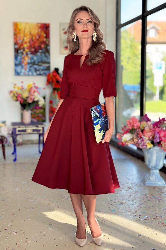 Dark red dress with circle skirts. Golden color detail in neckline