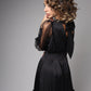 Elegant black satin dress with bows