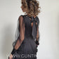 Elegant black satin dress with bows